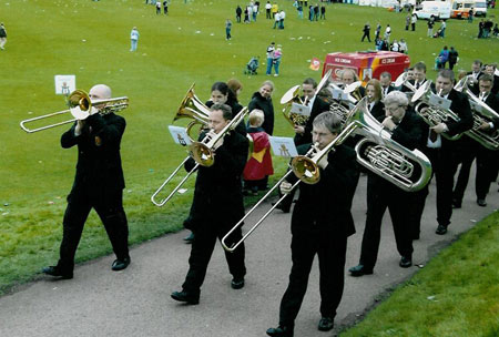 Marching off the field, trombones to the fore